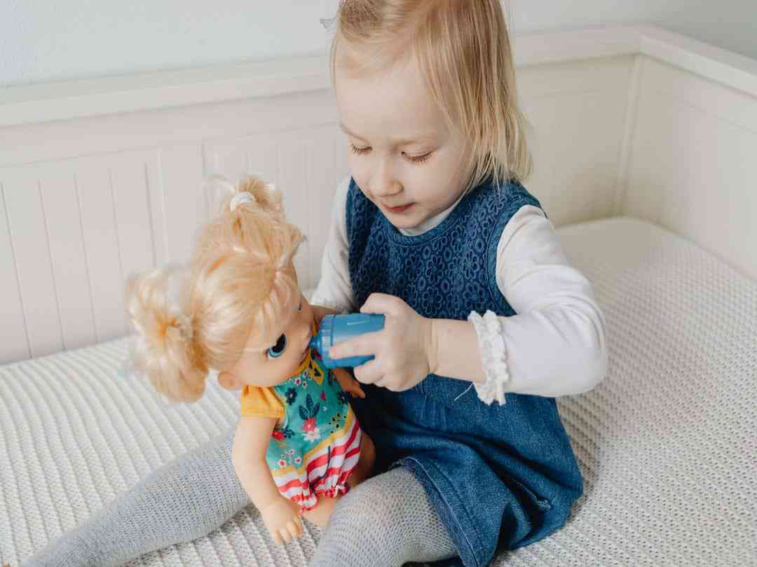 girl playing with doll